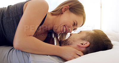 Buy stock photo Happy, couple and relax with romance on bed for healthy relationship, weekend break and connection. Love, people and cuddle together in house with laughing, marriage commitment or wake up affection