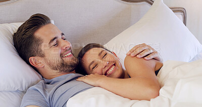 Buy stock photo Hug, happy and couple in bed in morning for bonding, relaxing and resting on weekend together. Home, bedroom and man with woman for wake up, comfortable and embrace with love, affection and care