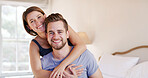 Portrait, couple and hug in bedroom for love, support and care in relationship with commitment in home. Happiness, man and woman for connection, embrace and trust in marriage with morning in house