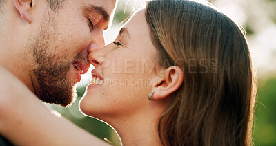 Buy stock photo Happy, kiss and couple hug in park for love, bonding and relationship together on weekend. Dating, nature and man with woman with affection for commitment, romance and celebrate anniversary outdoor