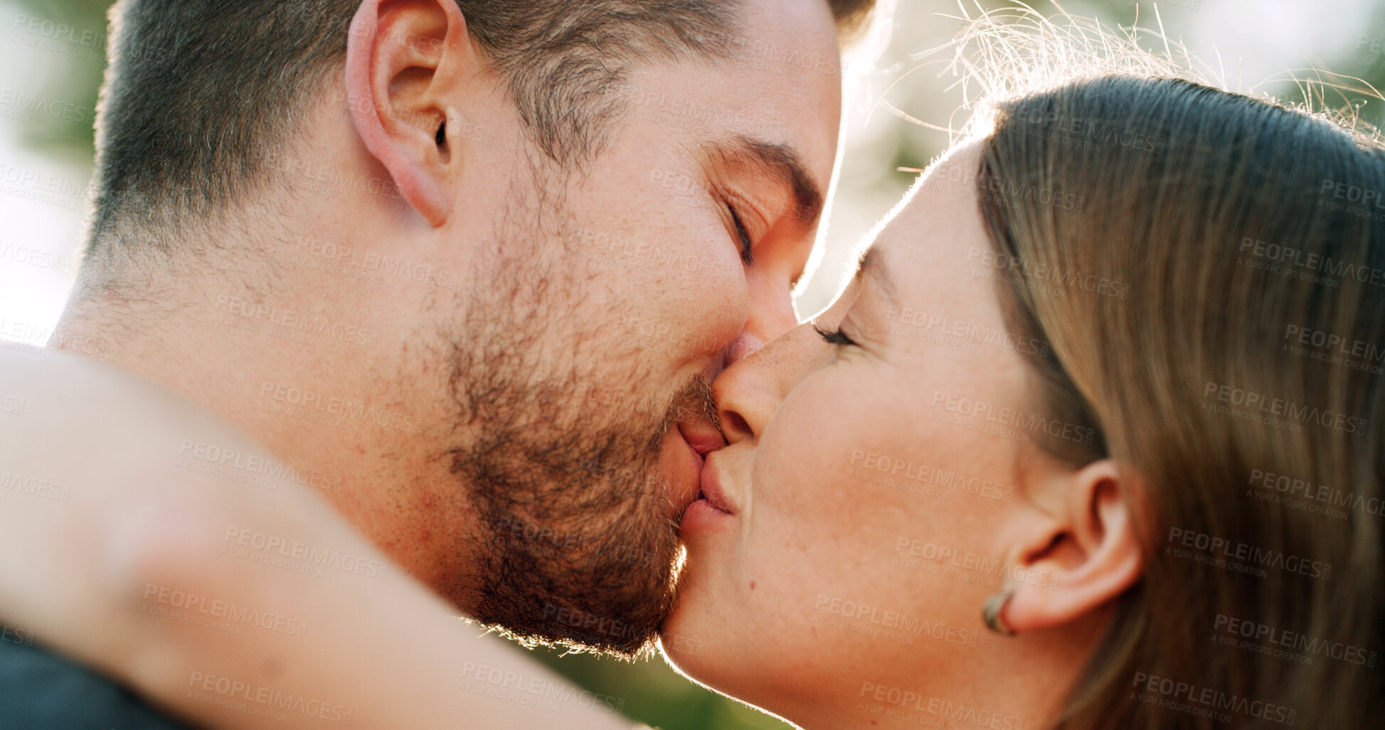 Buy stock photo Hug, kiss and couple in park for love, bonding and romantic relationship together on weekend. Dating, nature and man with woman with affection for commitment, trust and celebrate anniversary outdoor