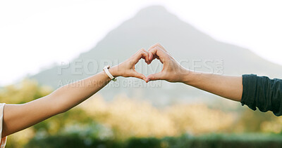 Buy stock photo Love, heart and hands of couple in park for anniversary, bonding and relationship together on weekend. Dating, nature and man with woman with emoji for commitment, romance and valentines day outdoor