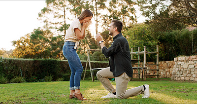 Buy stock photo Surprise, couple and proposal for engagement outdoor, excited and laughing with partner. Man, woman and shock with marriage question for love celebration, wow and romance with commitment on date