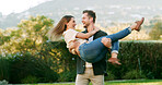 Couple, lift and hug with happiness in garden, celebration or energy for love, trust and outdoor with laugh. Marriage, excited and healthy relationship with man carrying woman for bonding in nature