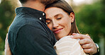 Happy, hug and couple in park for trust, bonding and relationship on weekend outdoor for commitment. Dating, nature and man with woman embrace for affection, support and romance together in garden