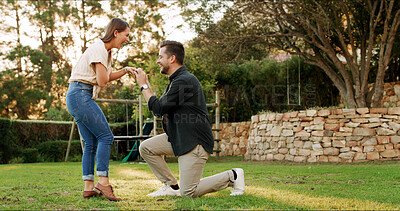 Buy stock photo Proposal, woman and couple in nature, excited or ring for commitment in relationship, love and care. Outdoor, man and asking for marriage, engagement and happy people at park, bonding and romance