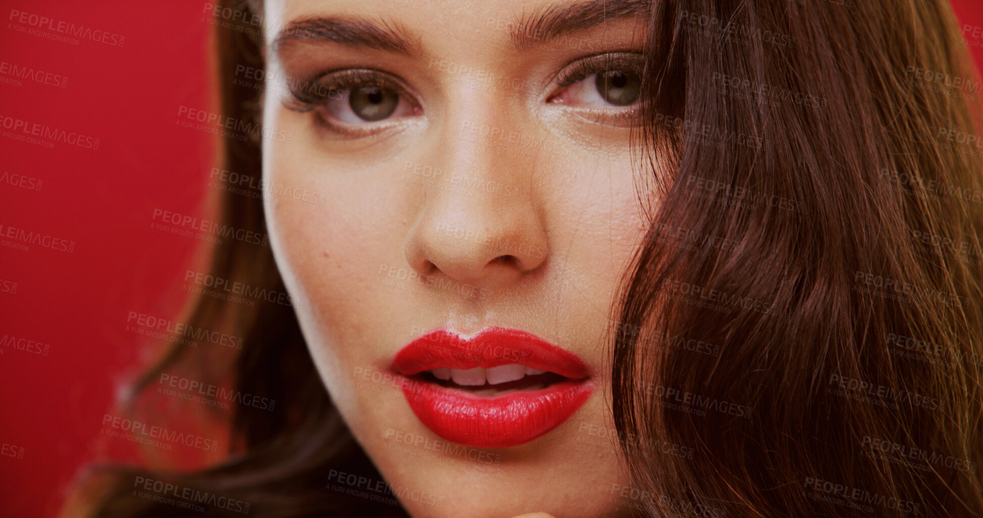 Buy stock photo Portrait, lipstick and woman in studio for beauty, makeup and cosmetology with face on red background. Lips, female person with glamour or bold color for luxury cosmetics with aesthetic and glow