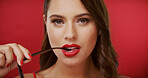 Portrait, lipstick and woman in studio with flirt, beauty and cosmetology on background. Red lips, female person and model with glasses bite, space and luxury cosmetics for aesthetic and glow