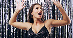 Streamers, surprise and face of woman at party for New Years Eve, club event and celebration. Birthday, nightclub and person with shocked, sparkles and fashion for disco, rave and entertainment