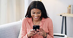 Smile, black woman and laugh with phone at house for communication, social media and website. Happy, female person and mobile for research, surfing internet and texting contact with chat notification