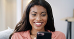 Woman, phone and smile for texting on sofa, relax or contact on web chat with online dating at home. African person, smartphone and happy with mobile app, post and social media on couch at apartment