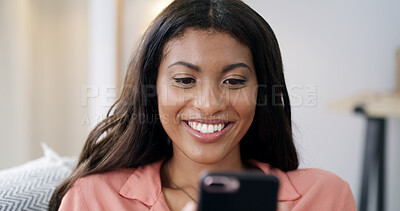 Buy stock photo Woman, phone and smile for texting on sofa, relax or contact on web chat with online dating at home. African person, smartphone and happy with mobile app, post and social media on couch at apartment