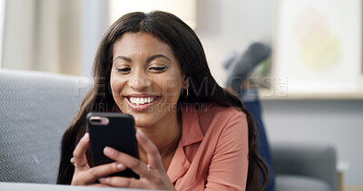 Buy stock photo Woman, phone and laugh for texting on couch, relax and contact on web chat for online dating at home. African person, smartphone and happy with mobile app, meme or social network on sofa at apartment
