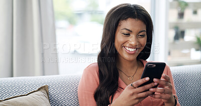 Buy stock photo Girl, phone and happy for texting on couch, relax and contact on web chat for online dating at home. African woman, smartphone and smile with mobile app, meme or social network on sofa at apartment
