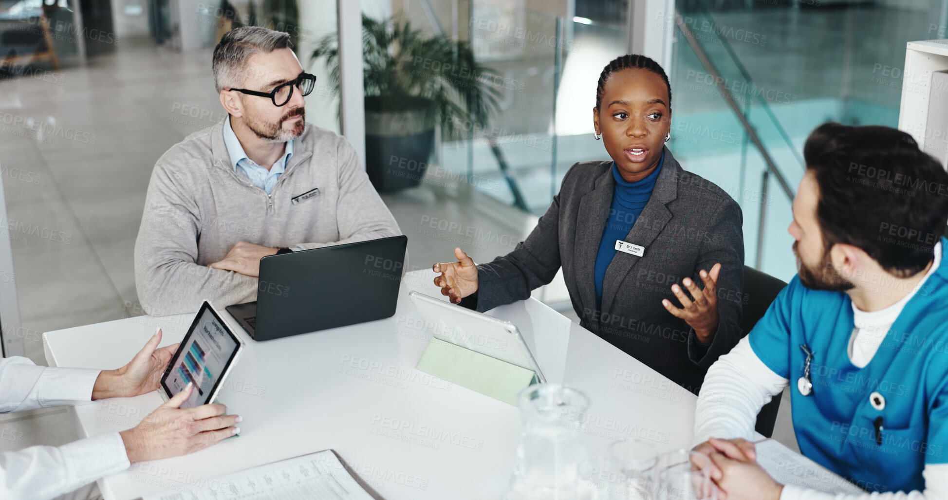 Buy stock photo Doctors, nurses and discussion with tablet in clinic for medical results, health stats or feedback. Above, people or medicine team with screen for hospital budget, surgery planning or healthcare cost