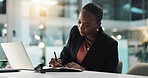 Woman, writing and notebook at office, night or admin for agenda planning for review with laptop. African, journalist and writer with story, editing process and overtime for article at media agency