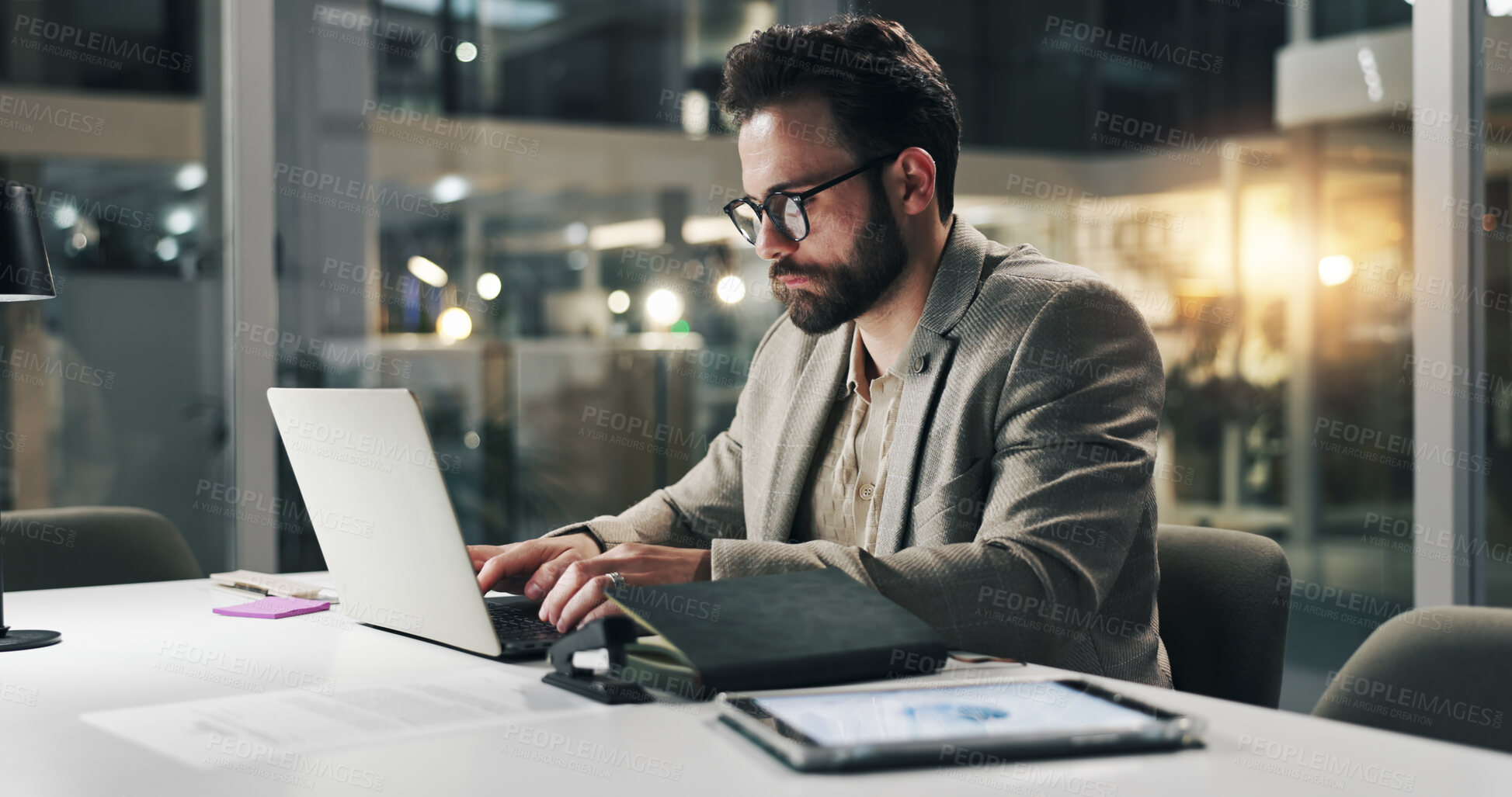 Buy stock photo Laptop, typing and night with business man in office for planning, insurance broker and feedback. Portfolio analysis, research and overtime with person in agency for client application and review