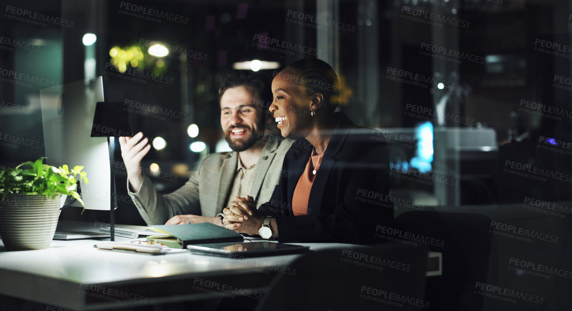 Buy stock photo Happy, business people and night with computer for project success or deadline together in office. Businessman, woman or employees working late with smile on technology for team productivity or app