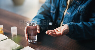 Buy stock photo Hands, pills and man with glass of water for medical treatment, prescription and tablets for recovery. House, health and person with medication container for vitamins, supplements and drugs on table