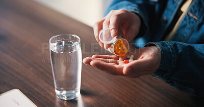Buy stock photo Water, pills and hands of man in house for medical treatment, prescription and tablets for recovery. Above, health and person with medication container for vitamins, supplements and drugs on table