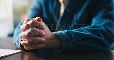Buy stock photo Job application, hands and prayer with person at desk in apartment for hope, opportunity or request. Documents, guidance and wish with man praying at table in home for career development or growth