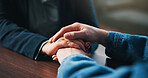 Holding hands, table and couple in home for empathy, support and bonding for love. Relationship, counseling and above of people together for connection, affection and care for commitment in house
