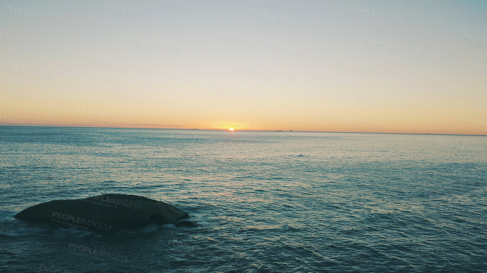 Buy stock photo Sunset, sky and landscape of ocean with rock for holiday destination, travel location and mockup. Space, sea and horizon in natural environment with tropical scenery, beach waves and weekend getaway