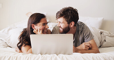 Buy stock photo Love, couple and happy with laptop in bed for streaming movie, connection and weekend break. Bonding, people and laughing with tech in home for watching film, show subscription and relationship trust