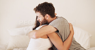 Buy stock photo Home, hug and couple in bedroom, love and bonding together with support, relationship and comfort. Apartment, man and woman with embrace, marriage and trust with care, relax and dating with romance