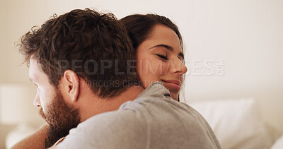 Buy stock photo Love, romance and couple with hug in bedroom for affection, bonding together or relationship. Space, smile and people with embrace in home for marriage commitment, protection or loyalty with security