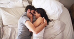 Love, happy and couple with hug on bed for marriage commitment, bonding together or protection. Above, people and laugh with affection in bedroom for healthy relationship, funny joke or trust in home