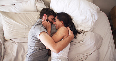 Buy stock photo Love, happy and couple with hug on bed for marriage commitment, bonding together or protection. Above, people and laugh with affection in bedroom for healthy relationship, funny joke or trust in home
