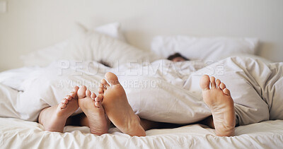 Buy stock photo Feet, house and couple sleeping in bedroom for rest, peace and blanket for comfort in morning. Barefoot, people and relax in bed together on mattress with nap, tired and break on weekend in home