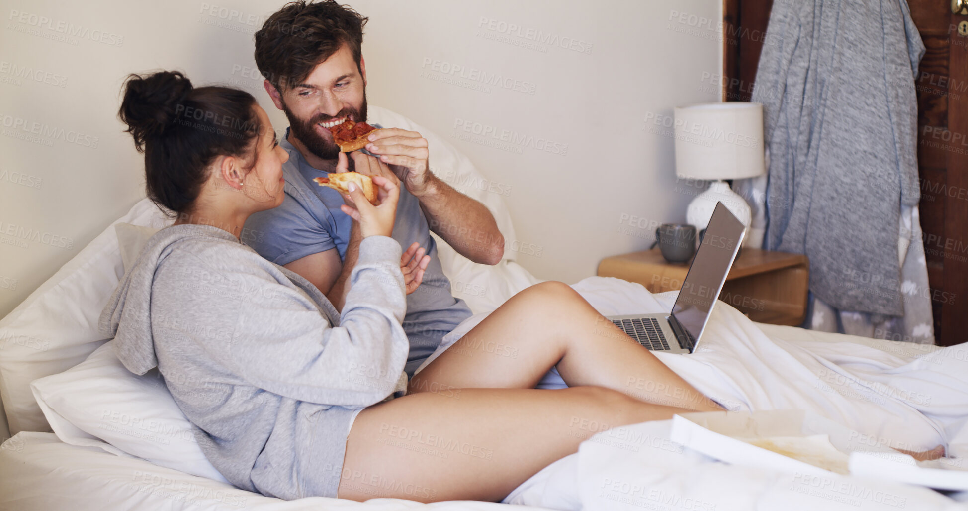 Buy stock photo Food, laptop and couple with pizza on bed watching movie, series or show together on weekend. Happy, home and man with woman for eating takeout meal with computer for streaming film in bedroom.