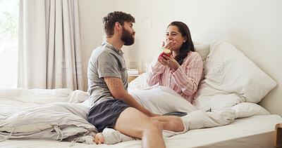 Buy stock photo Bedroom, eating and couple with cupcake, love and bonding together with happiness, delicious or care. Home, morning or man with woman, dessert or romantic with relationship, smile or tasty with snack