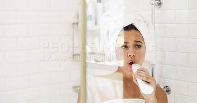 Buy stock photo Woman, shower and singing with bottle in bathroom, grooming and towel for hair care in home. Girl, voice and performance with morning routine, hygiene and shampoo with karaoke song at apartment