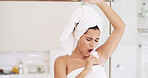 Girl, voice and singing in bathroom, home and grooming with shampoo bottle for hair care. Woman, towel and music performance with morning routine, hygiene and karaoke with dancing at apartment