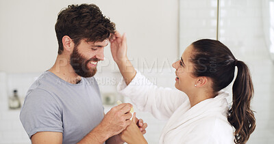 Buy stock photo Skincare, cream and help with couple in bathroom for beauty, support and sunscreen protection. Cosmetics, bonding and dermatology with man and woman in home for uv lotion, glow and SPF product