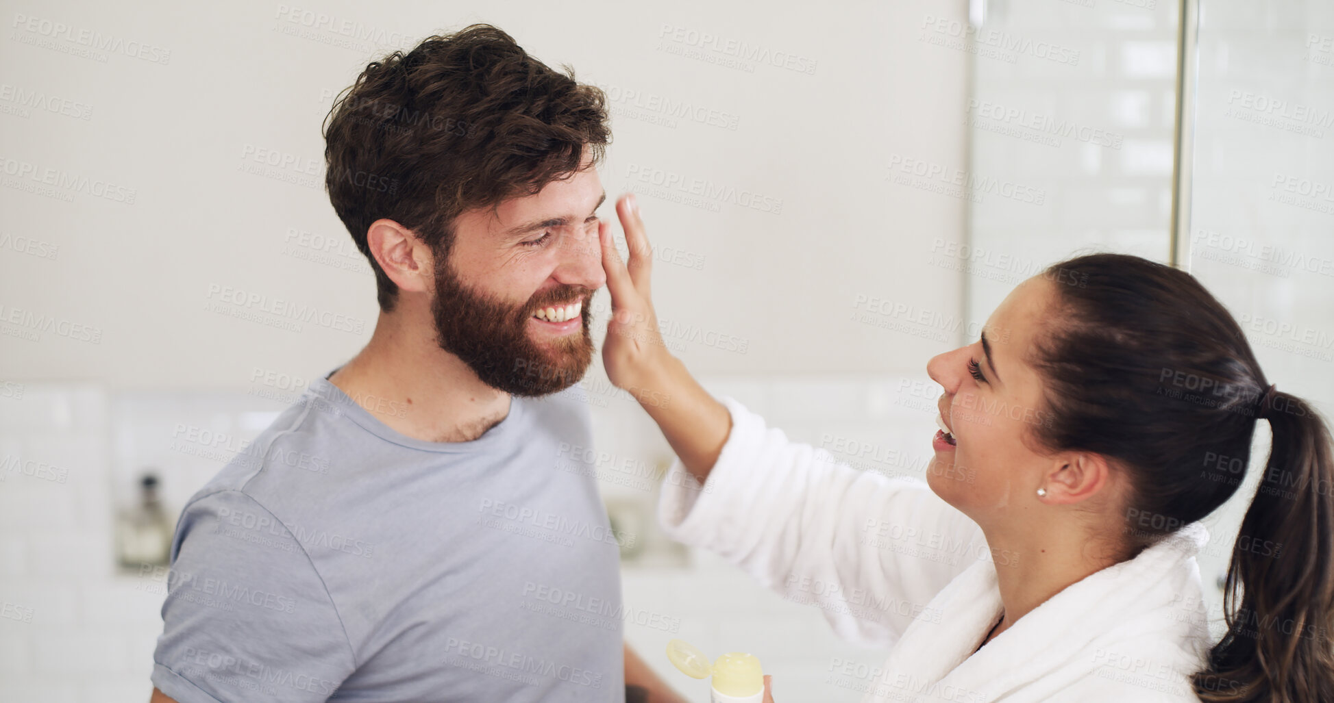 Buy stock photo Skincare, cream and morning with couple in bathroom for beauty, support and sunscreen protection. Cosmetics, bonding and dermatology with man and woman in home for uv lotion, glow and spf product