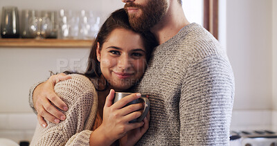 Buy stock photo Coffee, hug and portrait of woman in kitchen of home together for bonding, safety or security. Chest, drinking beverage and smile with happy couple embracing in apartment for break, love or trust