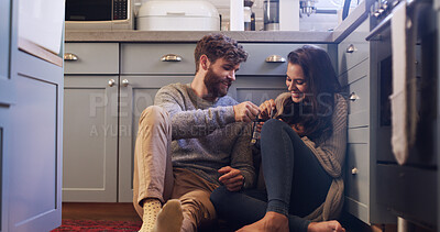 Buy stock photo Smile, couple and eating ice cream on floor with love, sharing dessert and bonding together. Happy, people and relax with sweet treat for romantic date, frozen snack and marriage commitment at house