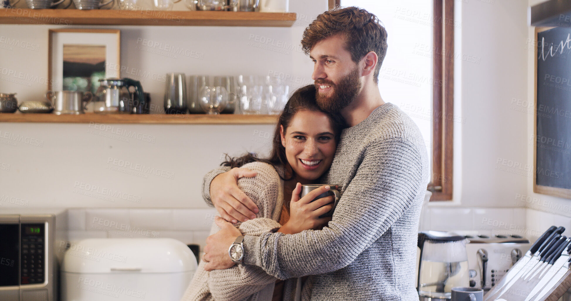 Buy stock photo Coffee, hug and smile with couple in kitchen of home together for bonding, safety or security. Drink, love and morning with portrait of woman on chest of man, embracing in apartment for trust