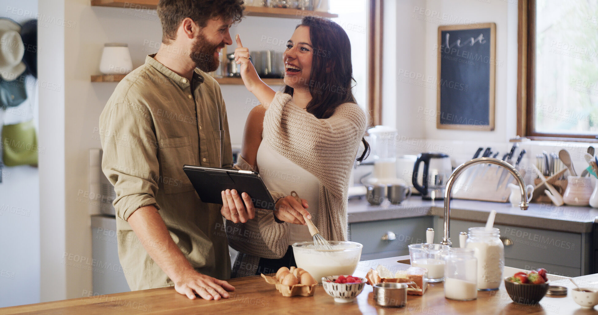 Buy stock photo Kitchen, play or happy couple on tablet for baking recipe method, lunch or guide in home together. Online tutorial, nose joke or funny people in house with cooking instruction, food or meal steps