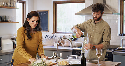 Buy stock photo Pouring, wine and couple in kitchen, cooking and ingredients for meal prep, culinary and commitment. People, together and alcohol in home, nutrition and recipe for dinner, relationship or marriage