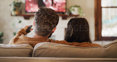 Buy stock photo Back, relax and watching TV with couple on sofa in living room of home for video streaming. Entertainment, movie and television with people in apartment together for bonding, subscription or film