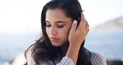 Buy stock photo Woman, beach and thinking on vacation with memory, hair and outdoor for getaway by sea in summer. Girl, reflection and perspective with insight, inspiration and hairstyle by ocean in Portugal