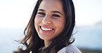 Portrait, travel and happy woman at beach for holiday, summer trip and adventure in nature. Sea, tourist and smile with person outdoor with confidence on vacation at ocean on island in Australia