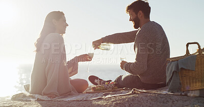 Buy stock photo Beach, picnic and couple with love, champagne and bonding together with vacation, relax and romance. Ocean, alcohol and man with woman, anniversary and celebration with summer holiday or relationship