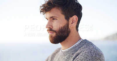 Buy stock photo Serious, man and thinking for travel at ocean for fresh air, sightseeing and vacation reflection. Male person, rest and thoughts for tourist planning, holiday memory and morning peace of getaway trip
