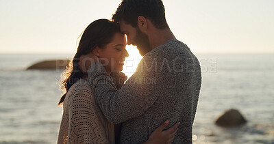 Buy stock photo Couple, smile and love with sunset on beach for summer vacation, romantic date and bonding. Happy, man and woman with travel, tropical holiday and affection for relationship and commitment at ocean